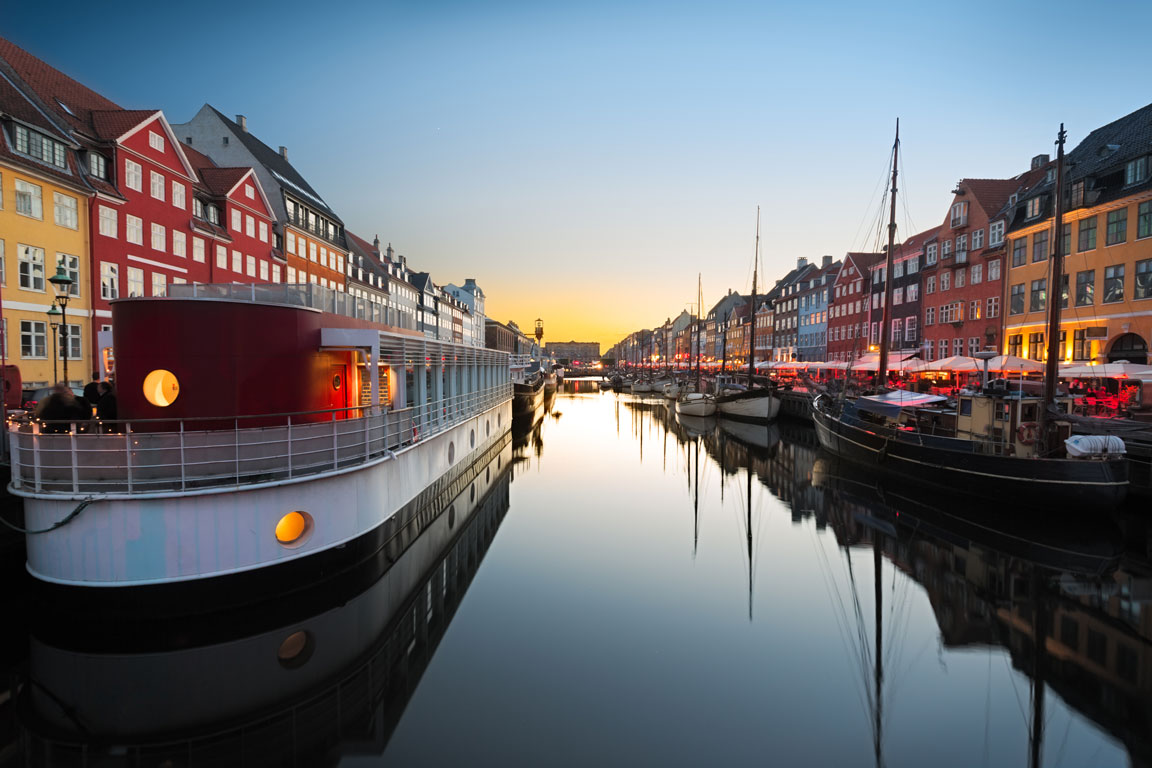 Ships in Nyhavn at sunset, Copenhagen, Denmark